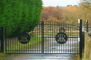 electric steel gates in wooded area