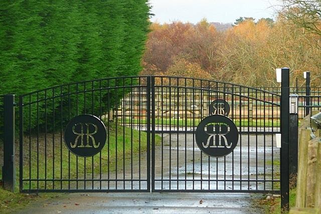 electric steel gates in wooded area