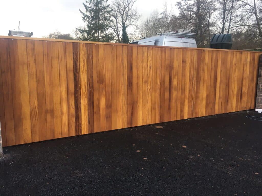 Sliding wooden electric gates installed by TPS. Serving Worcester with bespoke solutions.